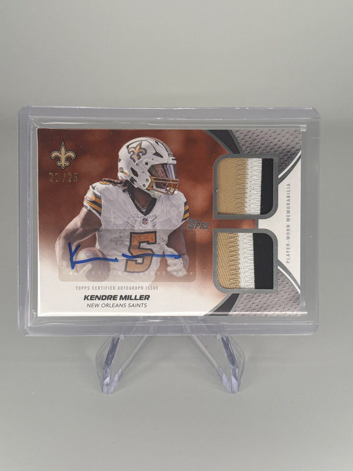 Kendre Miller 2026 Topps Flagship Dual Relic Auto Orange, 22/25