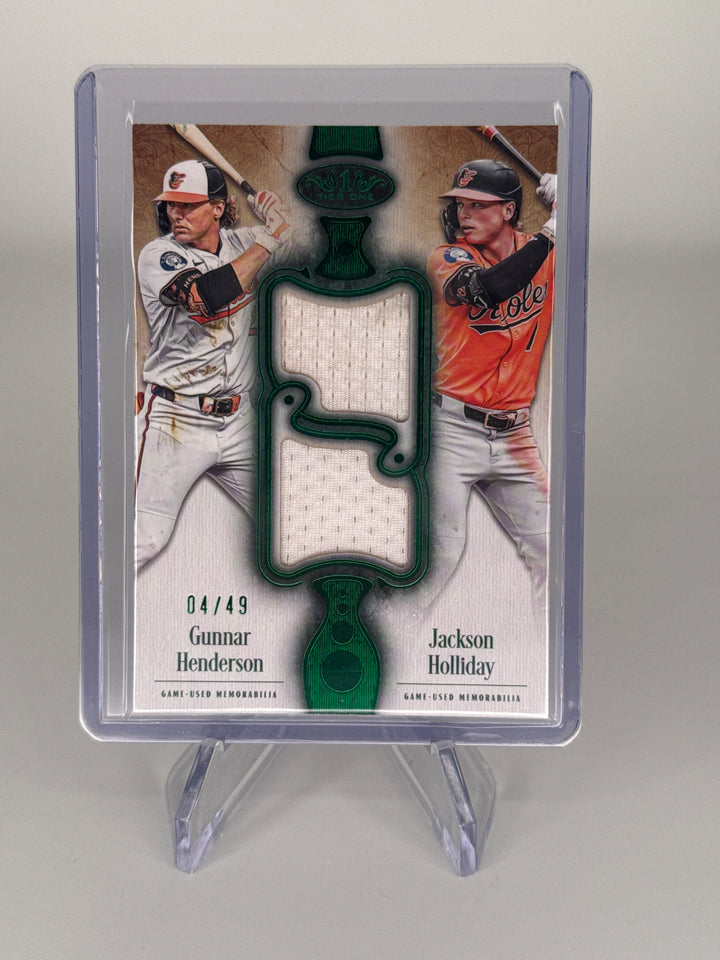 Gunnar Henderson/Jackson Holliday 2026 Topps Tier One Green Foil Dual Relic, 04/49