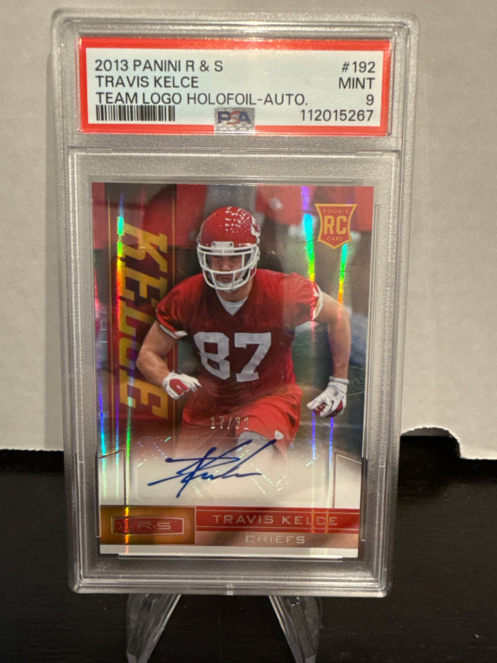Travis Kelce 2013 Panini Rookies & Stars Team Logo Holofoil Rookie Auto, 17/32, PSA 9 Mint