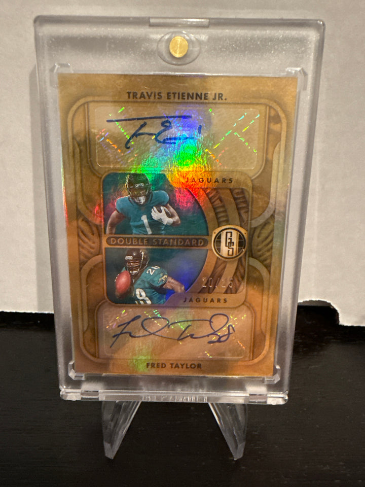Travis Etienne/Fred Taylor 2022 Panini Gold Standard Double Standard Dual Auto, 20/25