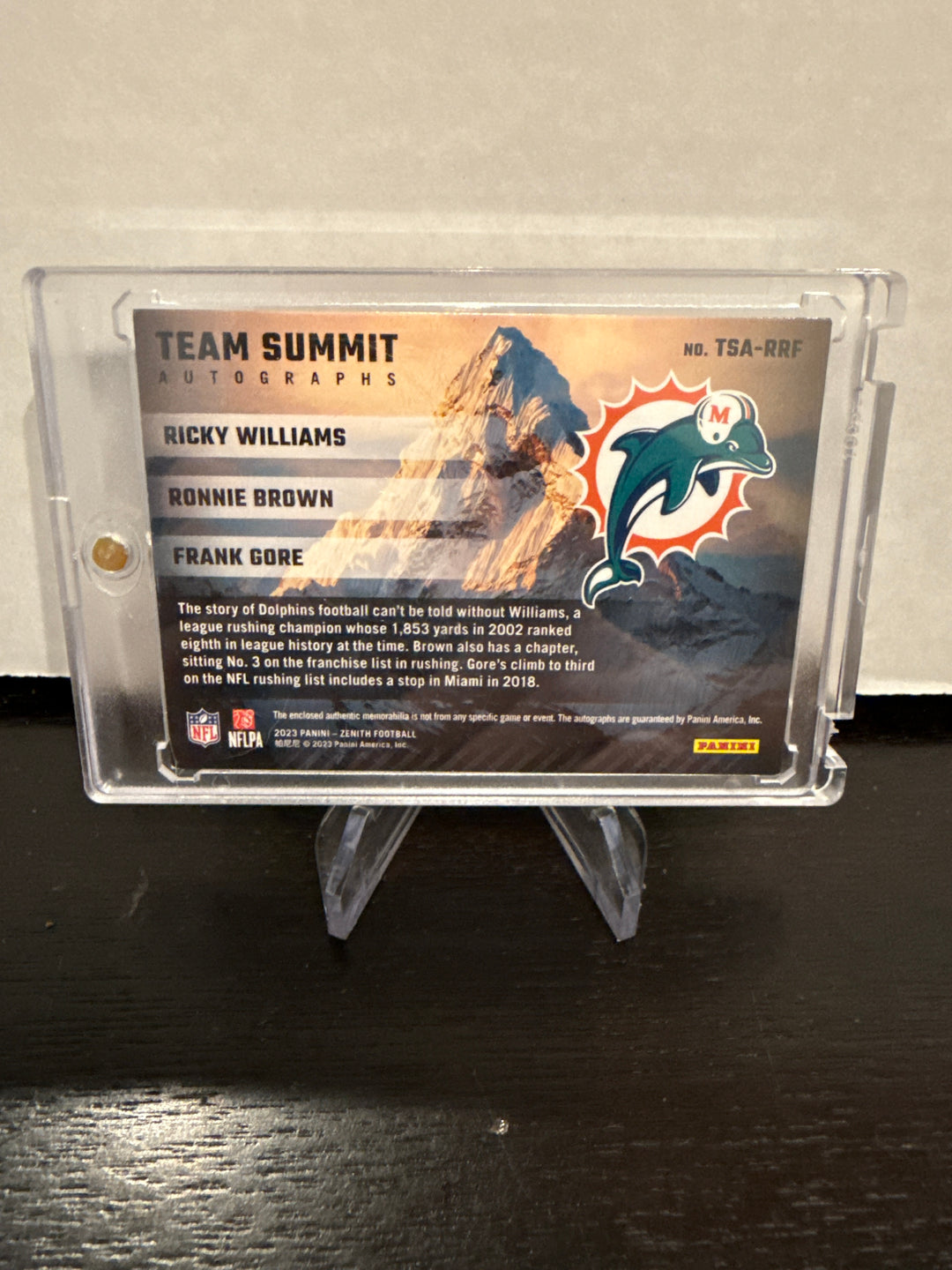 Ricky Williams/Ronnie Brown/Frank Gore 2023 Panini Zenith Team Summit Triple Patch Auto, 21/25