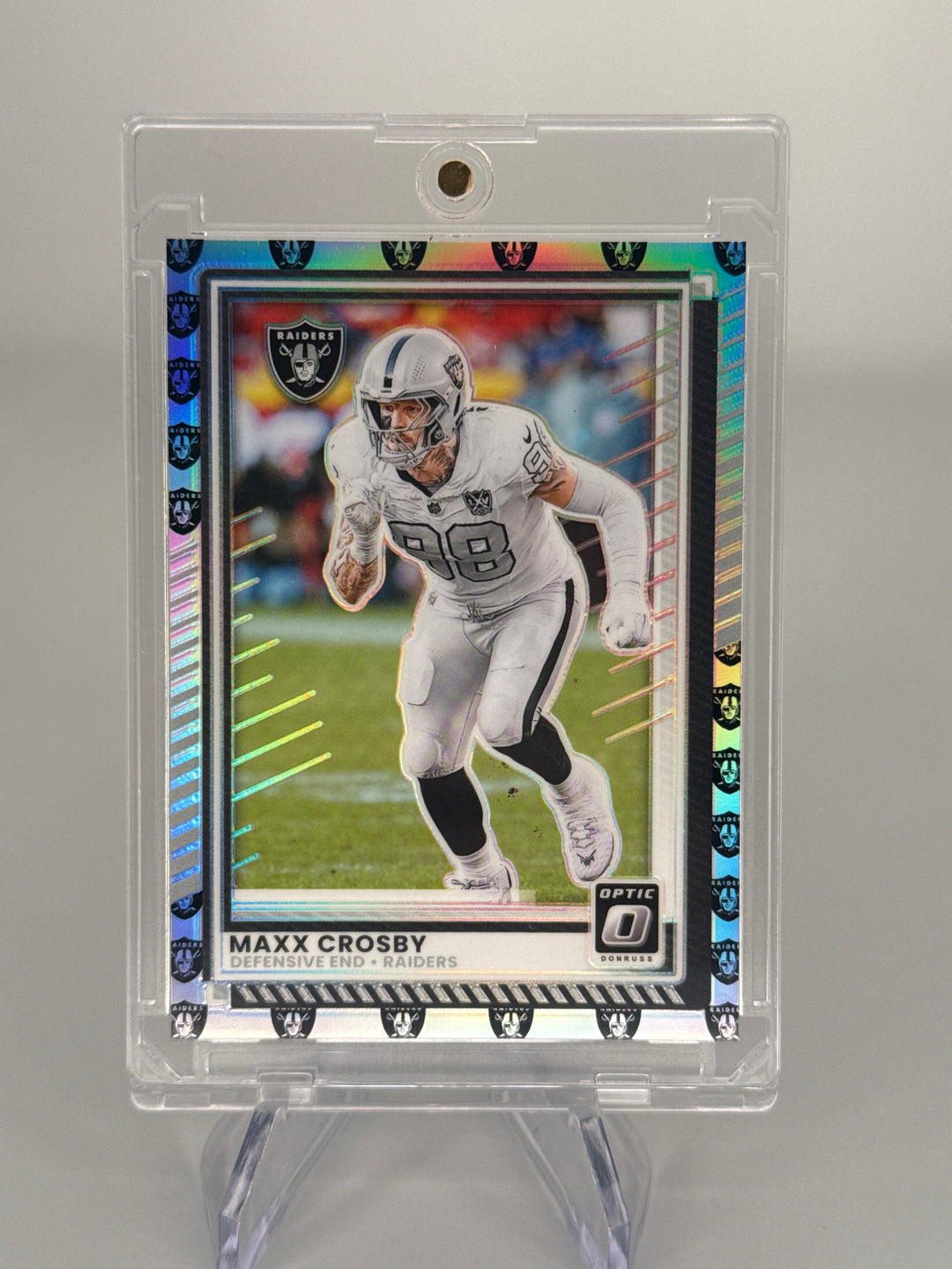 Maxx Crosby 2025 Panini Donruss Optic Team Logo Prizm, 21/32