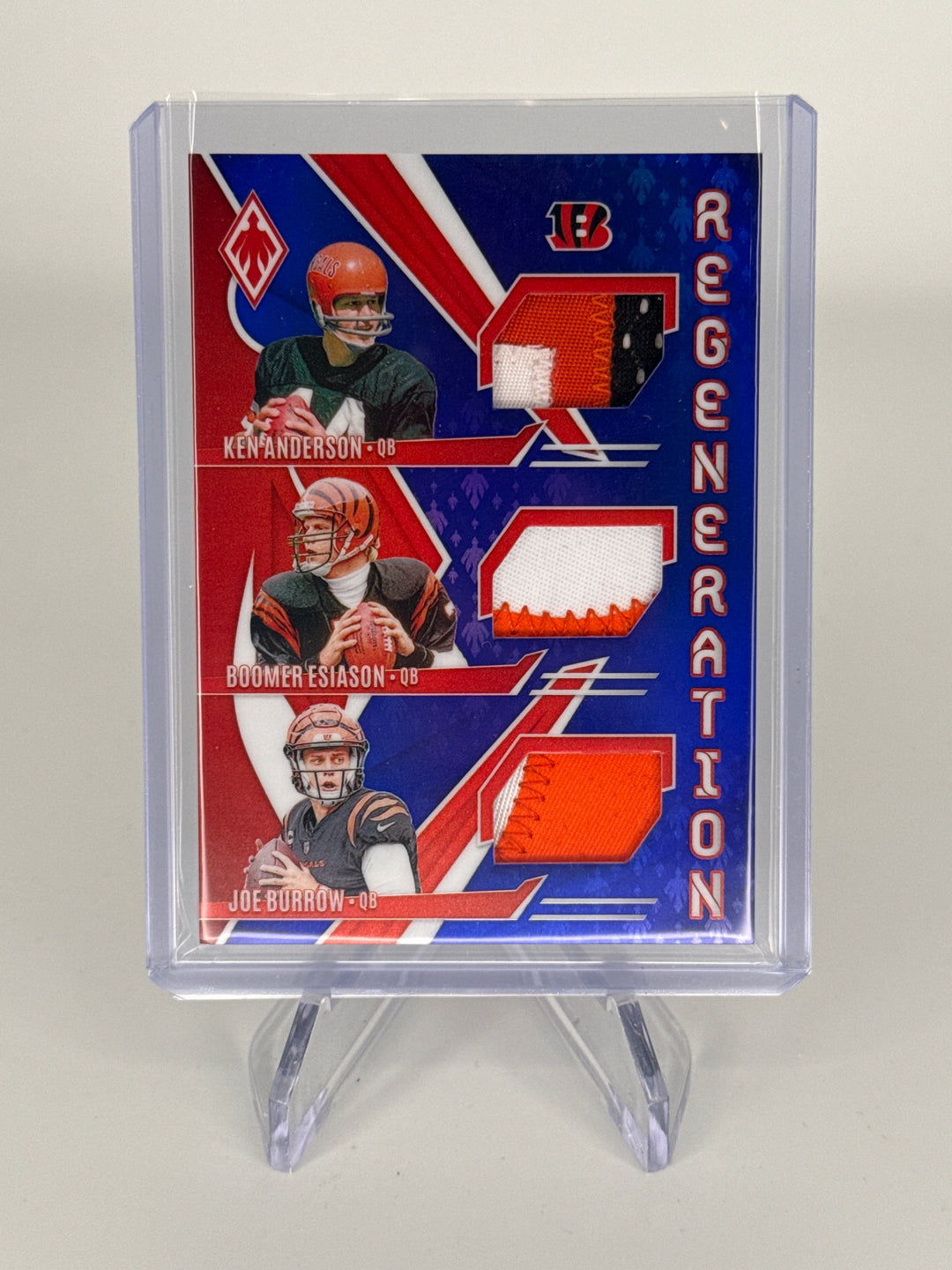 Ken Anderson/Boomer Esiason/Joe Burrow 2024 Panini Phoenix Regeneration Triple Relic Blue, 31/49